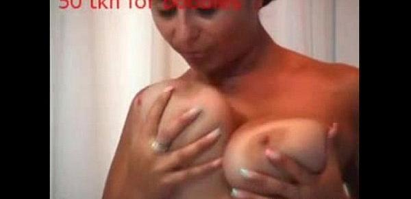  Big tit MILF flashes her tits and sucks on her nipple